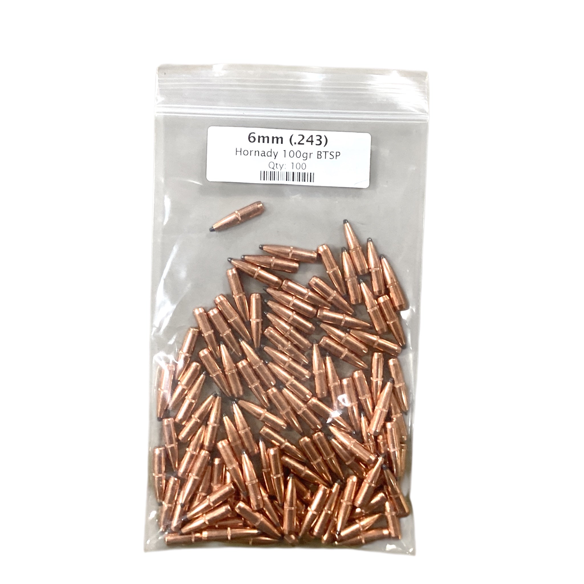 Clear plastic bag filled with copper-colored bullets labeled '6mm (.243) Hornady 100gr BTSP' on a white background.